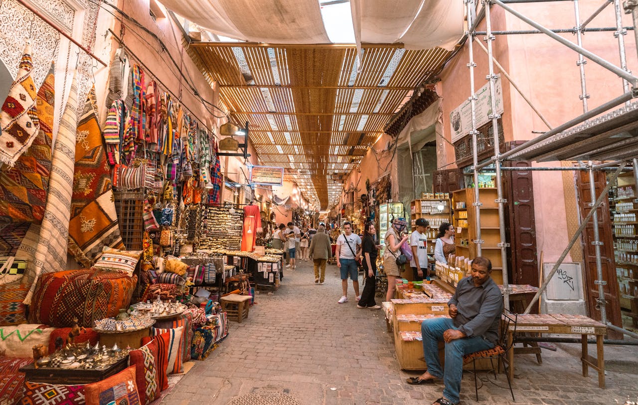 Home Explore the vibrant colors and lively atmosphere of a Marrakech souk, showcasing traditional crafts and local culture.