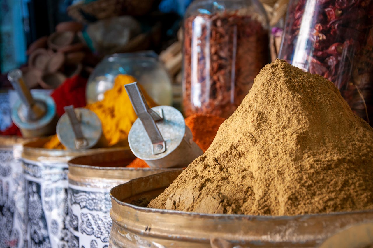 Home Vibrant spices displayed in a traditional Moroccan market in Marrakech.